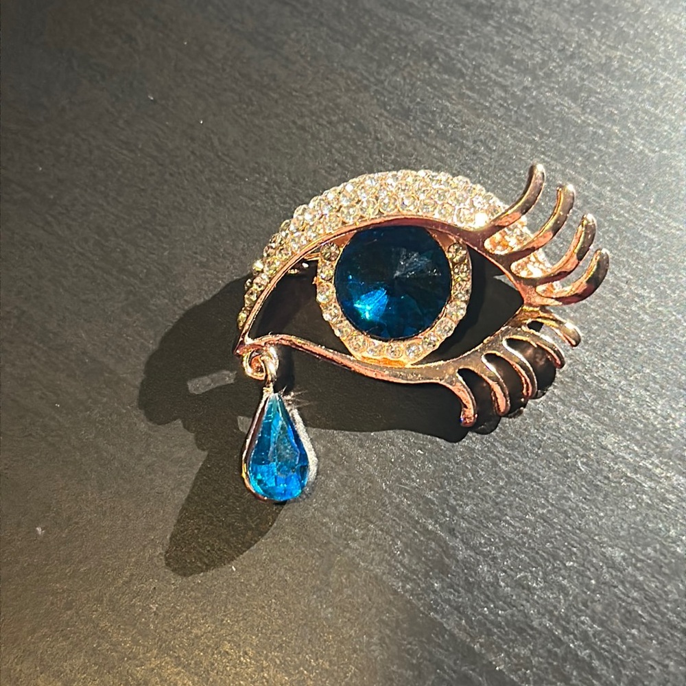 Blue tear drop eye brooch new